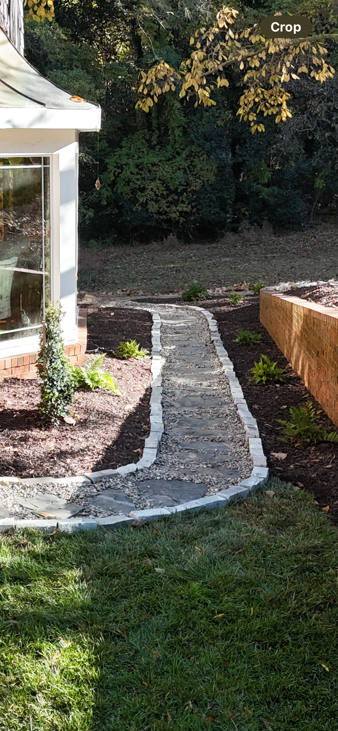 Finished landscaping project with lawn and mulch beds